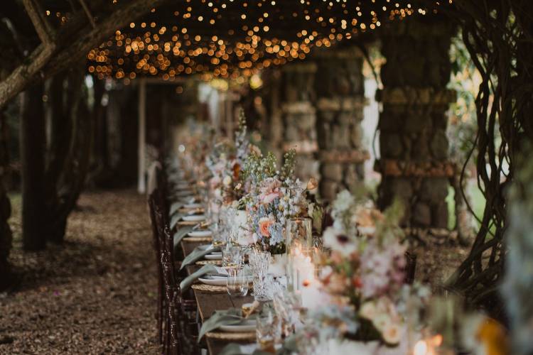 Garden wedding venue under a stone arbour at Port Stephens