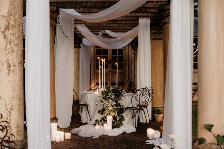 Wedding planning with white sheets and candles at outdoor Hunter Valley venue