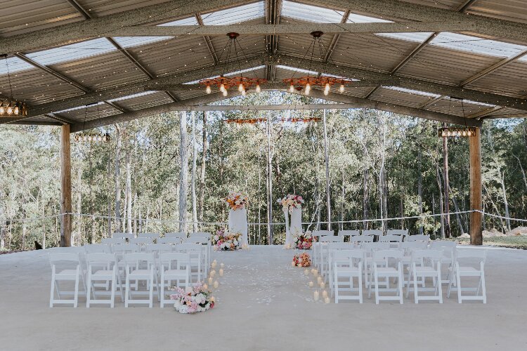 Beautiful wedding ceremony space in an open air forest shed