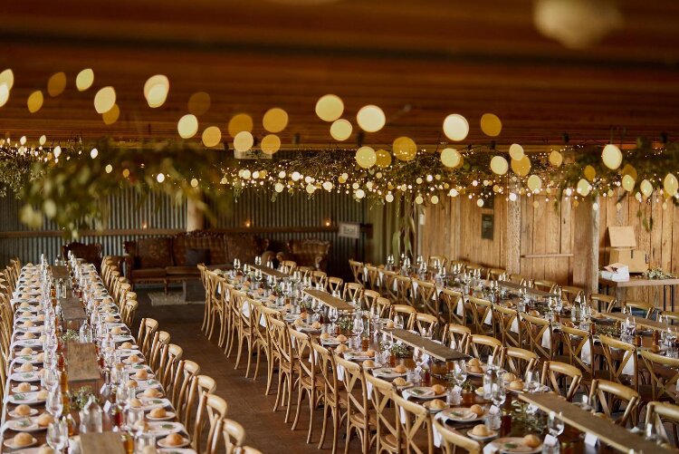 Rustic wedding barn with long timber tables in the Hunter Valley