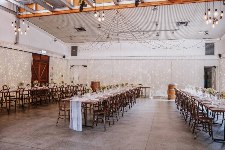 Tweed Coast reception venue with long tables and fairy lights