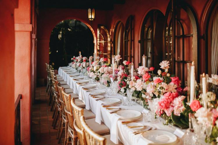 Wedding planner styled reception table with pink and gold accents