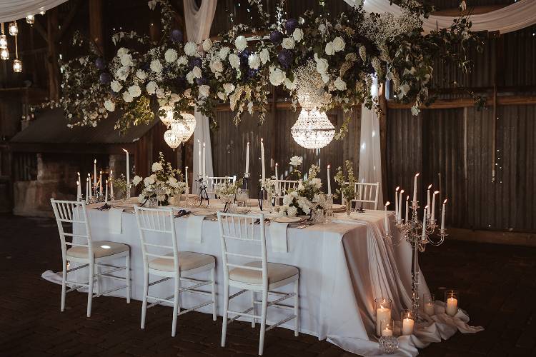 Wedding planner created reception table with chandeliers