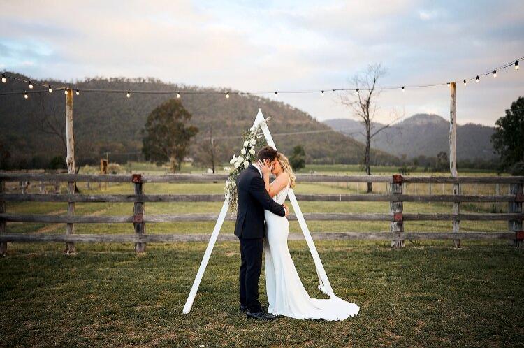 Marlu Station with a Hunter Valley wedding ceremony set up near mountains