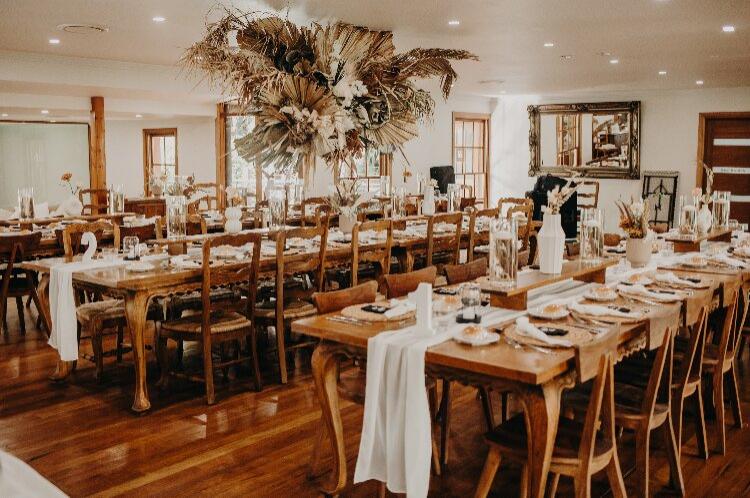 Rustic reception hall with timber accents at Leaves & Fishes in Lovedale NSW