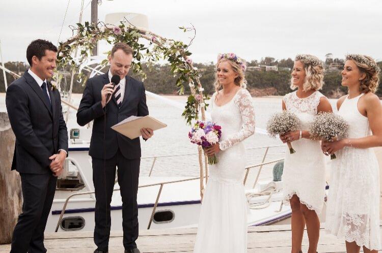 Experienced celebrant Chris Stedman officiating a Sydney Harbour wedding