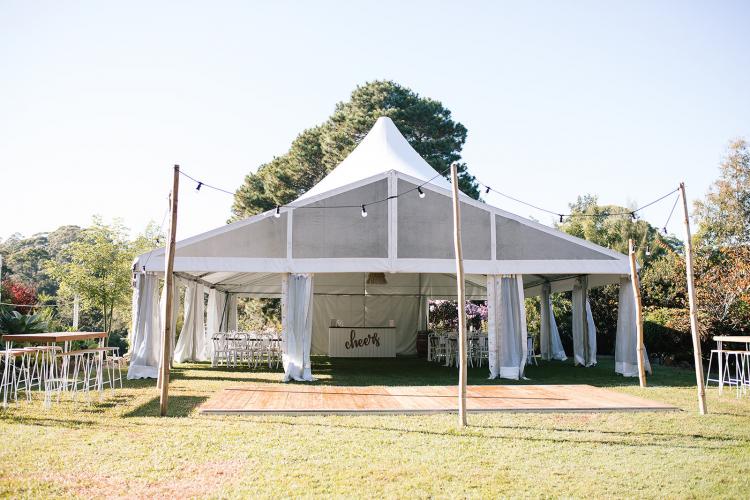 The Bellbird Gardens wedding reception marquee with wooden outdoor dance floor